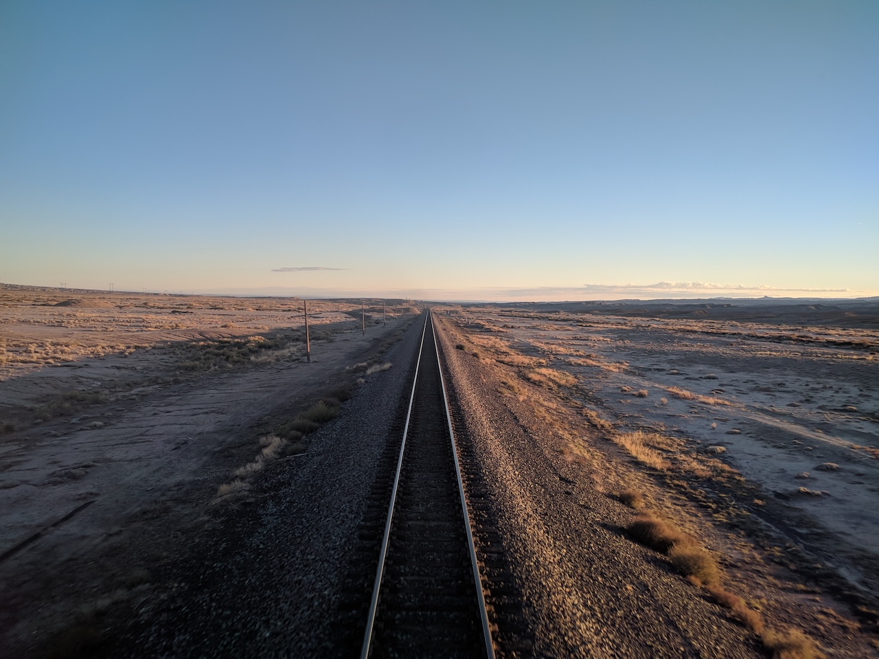 Railroad tracks disappear into the horizon